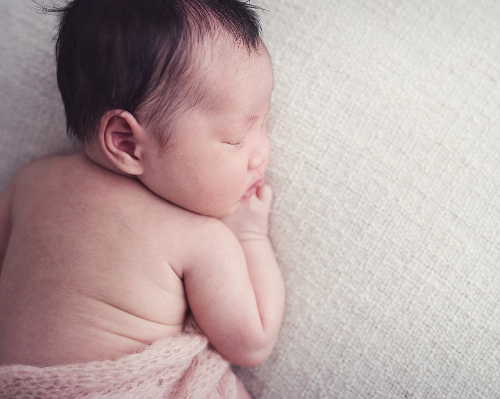 sleeping baby on stomach, image taken from above